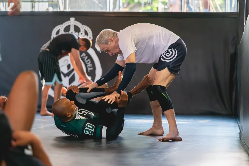 Students practising Brazilian Jiu-Jitsu techniques.