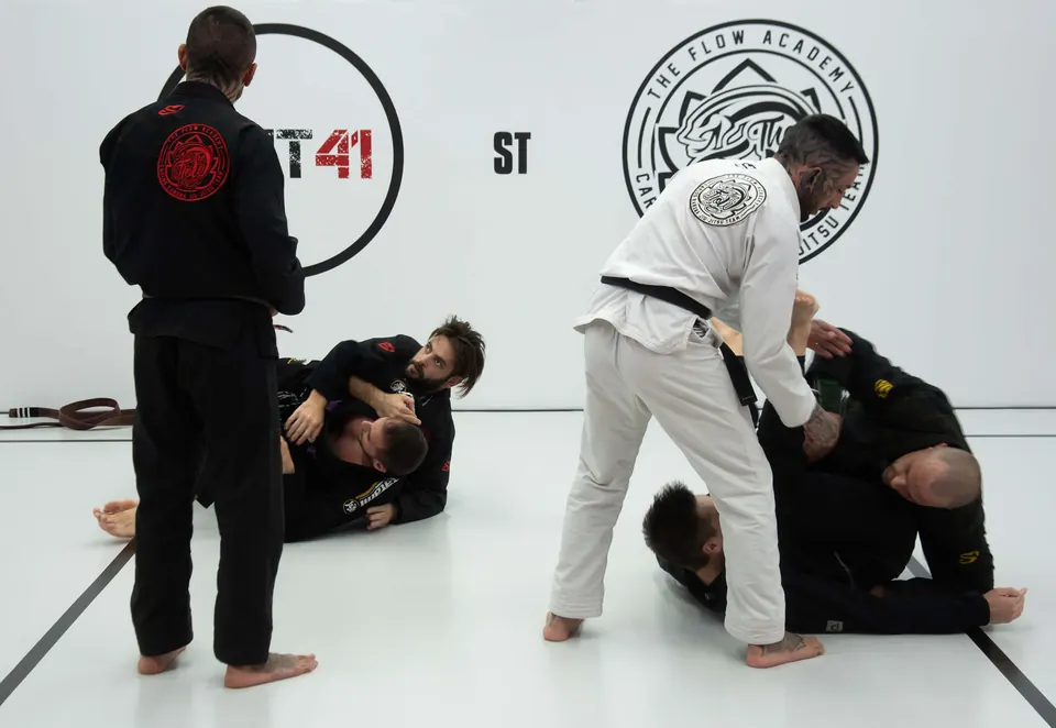 Instructor demonstrating a Jiu-Jitsu position during class at Unit 41
